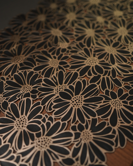 Close-up of metallic sunflower floral table mat design